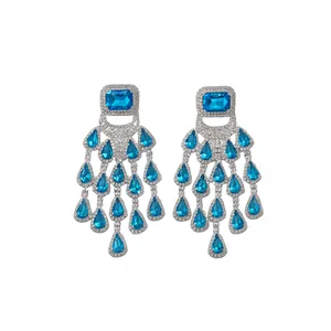 Elegant silver-tone chandelier earrings with blue square and teardrop rhinestone tassels