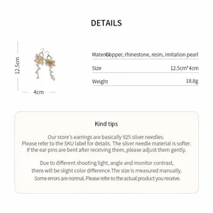 Detail view of long tassel earrings with dimensions and material specifications