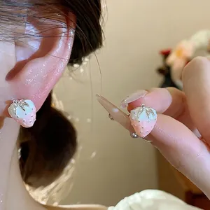 Delicate silver needle strawberry stud earrings with pink glitter and zircon details