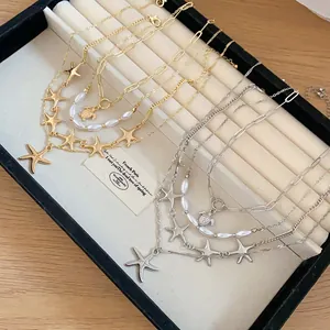 Nautical starfish and turtle layered necklaces in gold and silver finishes