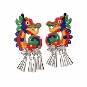 Handmade embroidered dragon earrings with silver tassels in traditional Chinese style