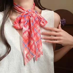 Close-up of a pastoral plaid mesh scarf necklace with orange and blue pattern