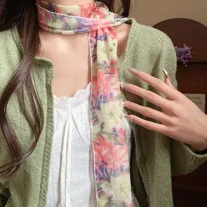 Close-up of elegant floral mesh scarf necklace tied on a model's neck
