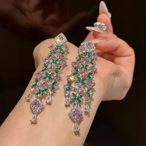 Detailed macro view of heavy-duty pink and green floral zircon drop earrings for women.