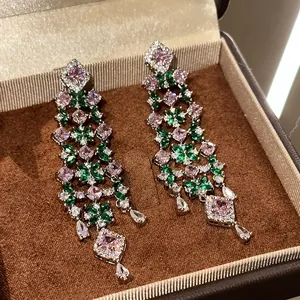 Exquisite close-up of luxury flower drop earrings with pink and green cubic zirconia