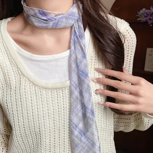Detail view of an elegant purple plaid mesh skinny scarf worn as a necklace choker