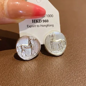 Vintage matte silver round stud earrings featuring an embossed horse design motif