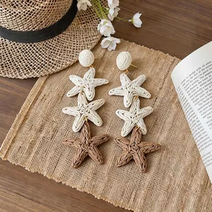 Handcrafted raffia starfish drop earrings for a chic summer beach vacation look