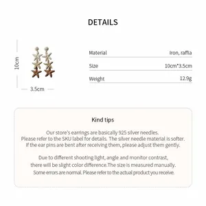 Detail view of raffia star tassel earrings with technical 925 silver needle specifications