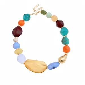 Bohemian chunky colorful acrylic beaded necklace with gold-tone irregular accents.
