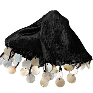 Elegant black fabric hair claw clip with iridescent shell tassel charms for women