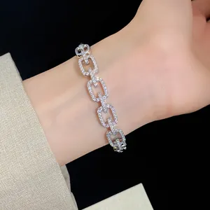 Close-up of elegant 18K gold plated square hollow link bracelet with paved zircons