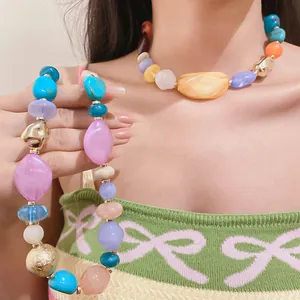 Close-up of colorful acrylic geometric beaded necklace in Bohemian style
