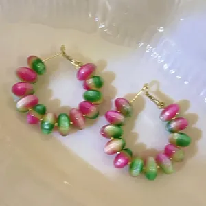 Handmade gradient pink and green beaded hoop earrings with gold-tone wire finish