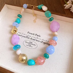 Detail of Bohemian style acrylic beaded necklace with irregular geometric colorful resin beads