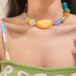 Close-up of colorful irregular acrylic beads on a bohemian style clavicle necklace