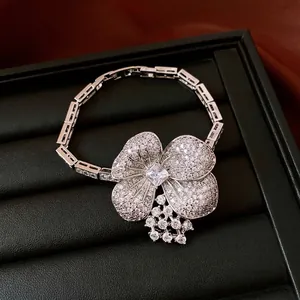 Exquisite silver flower pendant necklace with shimmering zircons on professional black jewelry box