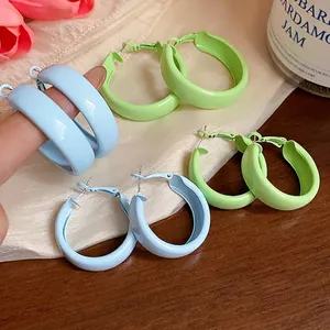 Minimalist colorful lacquered hoop earrings in vibrant blue and green dopamine style