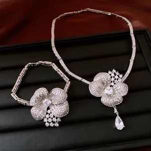 Detailed view of vintage style flower necklace and bracelet jewelry set with crystals