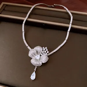 Detailed macro shot of an exquisite flower necklace with zircon teardrop pendant
