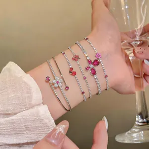 Close-up detail of French luxury zircon butterfly adjustable bracelets worn on wrist