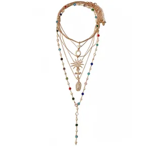 Retro layered six-piece necklace set with sun, cross, and portrait charms in gold