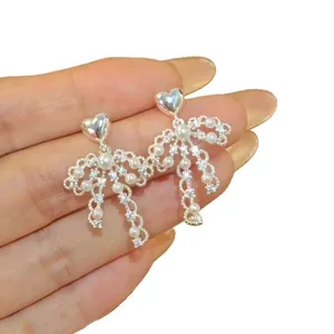 Elegant French vintage style silver heart pearl bow dangle earrings for stylish women