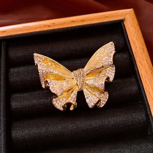 Elegant 18k gold plated butterfly brooch with shimmering rhinestones in a luxury display