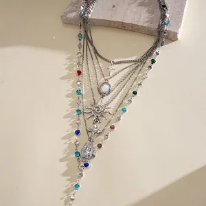 Detailed view of vintage silver multi-layered necklace set with religious charms