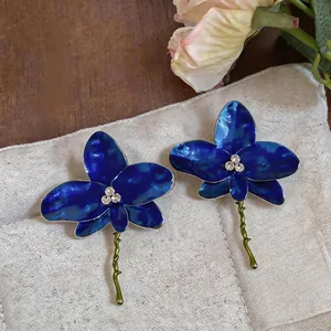 Elegant dark blue flower stud earrings with rhinestones and unique oil drip textured finish