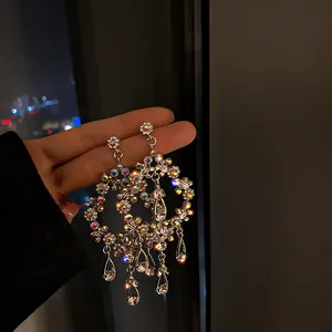Detailed view of luxury silver geometric earrings with sparkling AB rhinestones