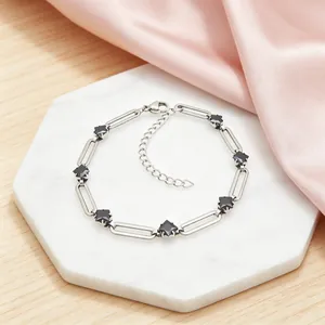 Close-up detail of 304 stainless steel paperclip link bracelet with black rhombus zircon