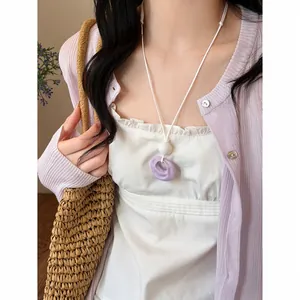 Elegant purple resin wrinkled circle pendant necklace with white leather cord for women.
