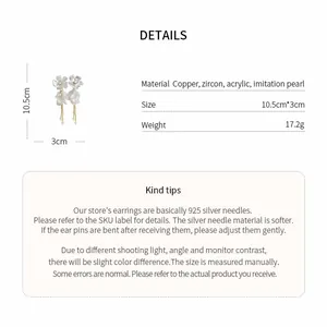 Close-up detail of acrylic flower earrings showing material specs and measurements