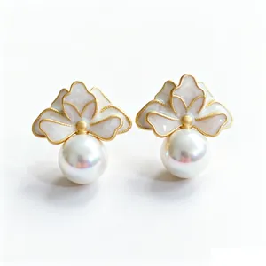 Elegant French style floral pearl stud earrings with gold trim and white enamel petals