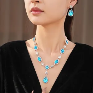 Elegant crystal necklace and earring set with blue teardrop rhinestones for women