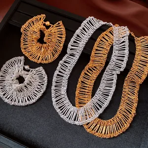 Detailed view of pleated lace jewelry set with magnetic clasps in gold and silver