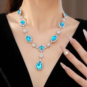 Luxury teardrop sapphire blue rhinestone necklace on elegant model clavicle