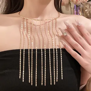 Close-up of elegant gold tassel choker necklace with multi-layer metal chains on model.