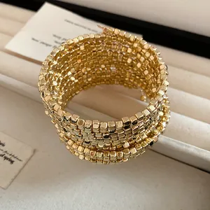 Detailed view of the multi-layer gold square bead wrap bracelet texture