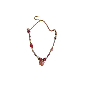 Pink beaded necklace with a cute ceramic puppy charm and elegant imitation pearls.