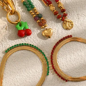 Detailed view of 18K gold plated stainless steel bracelets with colorful beads and charms.