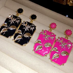 Vintage palace style rectangular earrings with floral rhinestones and enamel drip finish.