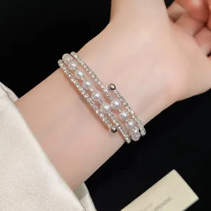 Detailed view of the elegant multi-layer wrap bracelet with pearls and rhinestones