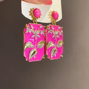 Vintage hot pink enamel rectangular stud earrings with elegant rhinestone flower details.