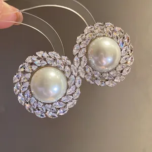 Elegant silver needle stud earrings with round pearl and marquise zircon halo design