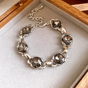 Close-up of the vintage silver bracelet featuring smoky grey faceted zircon stones