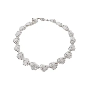 Elegant French style white pleated necklace with circular pearl accents on a plain background