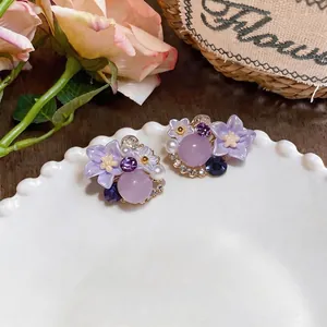 Exquisite purple flower earrings with pearls and crystals for a forest aesthetic style