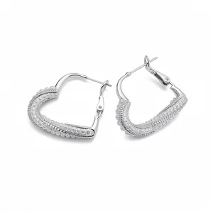 Elegant silver needle heart earrings with pearl and crystal studs on a white background